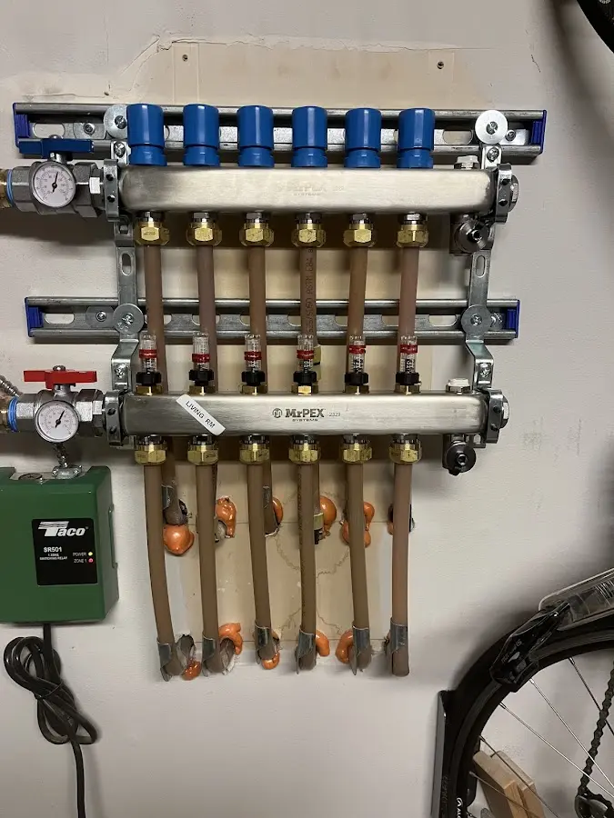 Plumber performing Gas Leak Detection at a residential property in Islandia